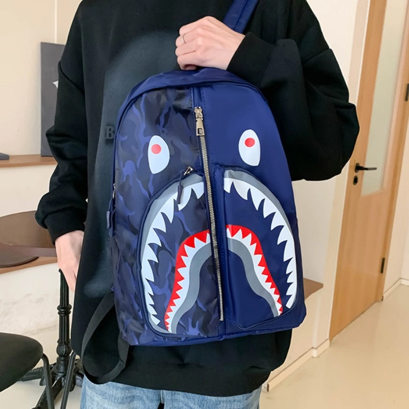 爱尔绅特 个性涂鸦鲨鱼学生休闲出行时尚潮流 尼龙 双肩包 男女同款情侣款 多色