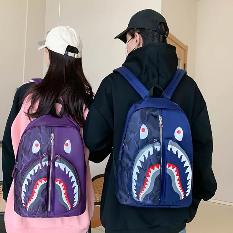 爱尔绅特 个性涂鸦鲨鱼学生休闲出行时尚潮流 尼龙 双肩包 男女同款情侣款 多色