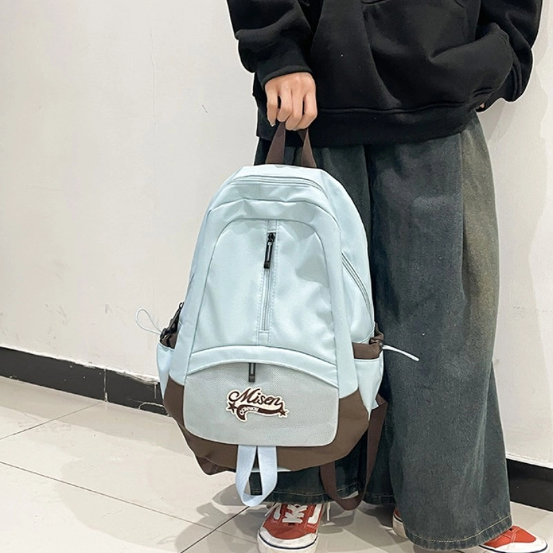 爱尔绅特 轻便休闲大容量潮流时尚小众设计 尼龙 双肩包 男女同款情侣款 白色黑色