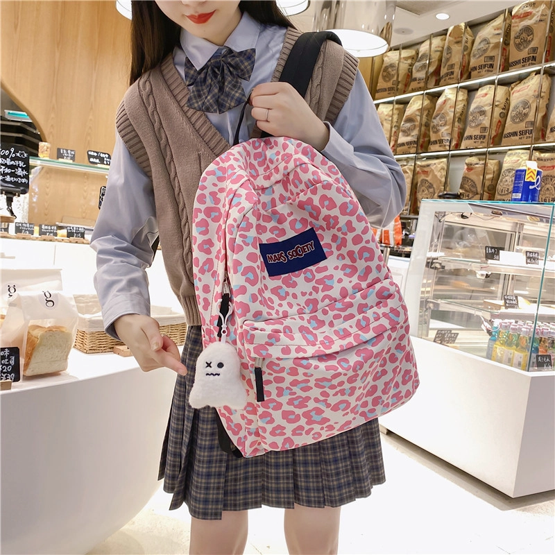 爱尔绅特 韩版原宿休闲街头潮流校园背包中小学生 尼龙 双肩包 男女同款情侣款 白色/黑色