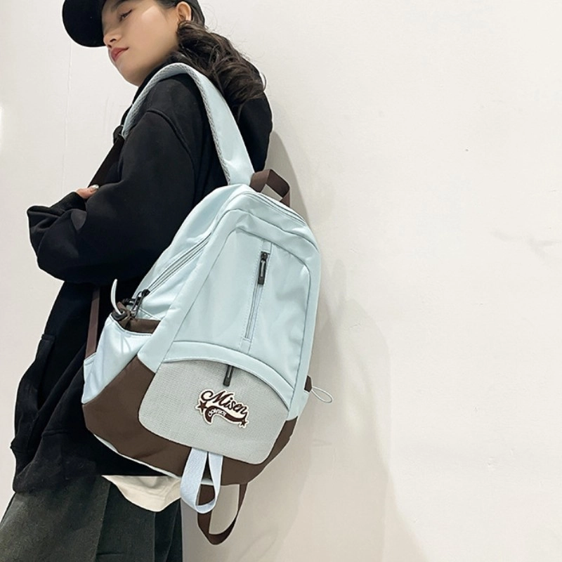 爱尔绅特 轻便休闲大容量潮流时尚小众设计 尼龙 双肩包 男女同款情侣款 白色黑色