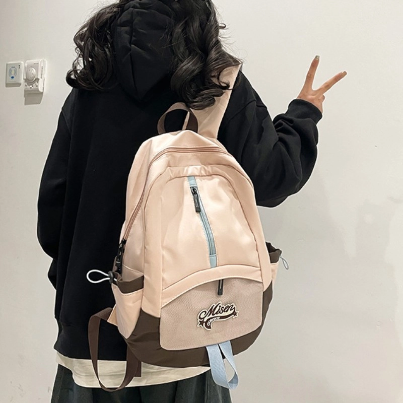 爱尔绅特 轻便休闲大容量潮流时尚小众设计 尼龙 双肩包 男女同款情侣款 白色黑色