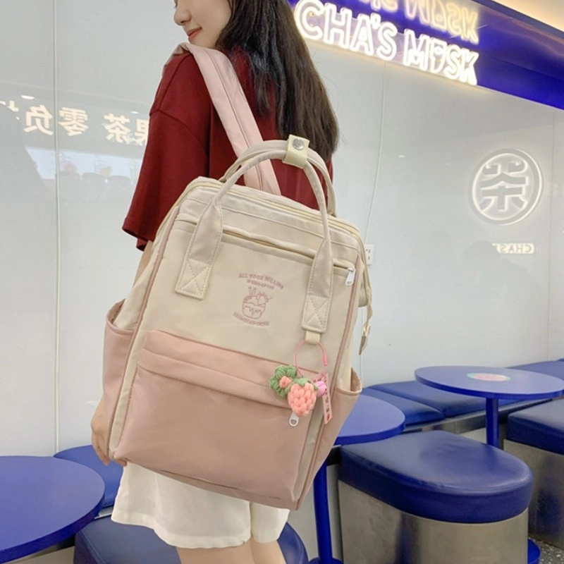 爱尔绅特 大容量百搭轻防水时尚初高中学生拼色简约 尼龙 双肩包 女款 白色/黑色