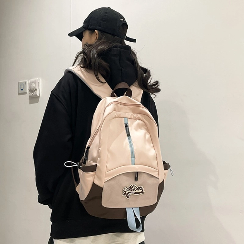 爱尔绅特 轻便休闲大容量潮流时尚小众设计 尼龙 双肩包 男女同款情侣款 白色黑色