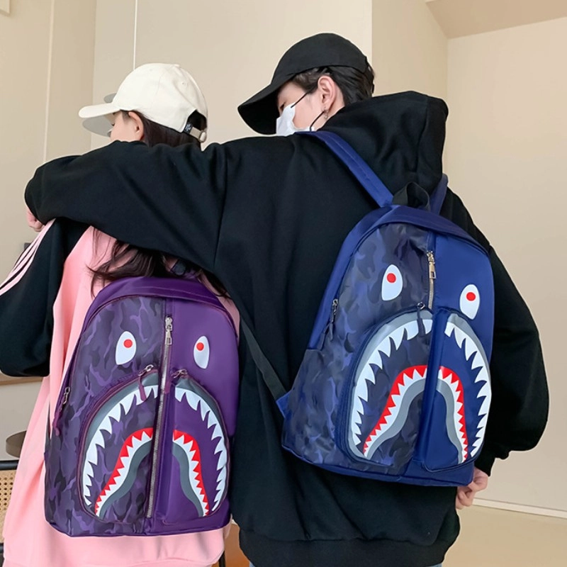 爱尔绅特 个性涂鸦鲨鱼学生休闲出行时尚潮流 尼龙 双肩包 男女同款情侣款 多色