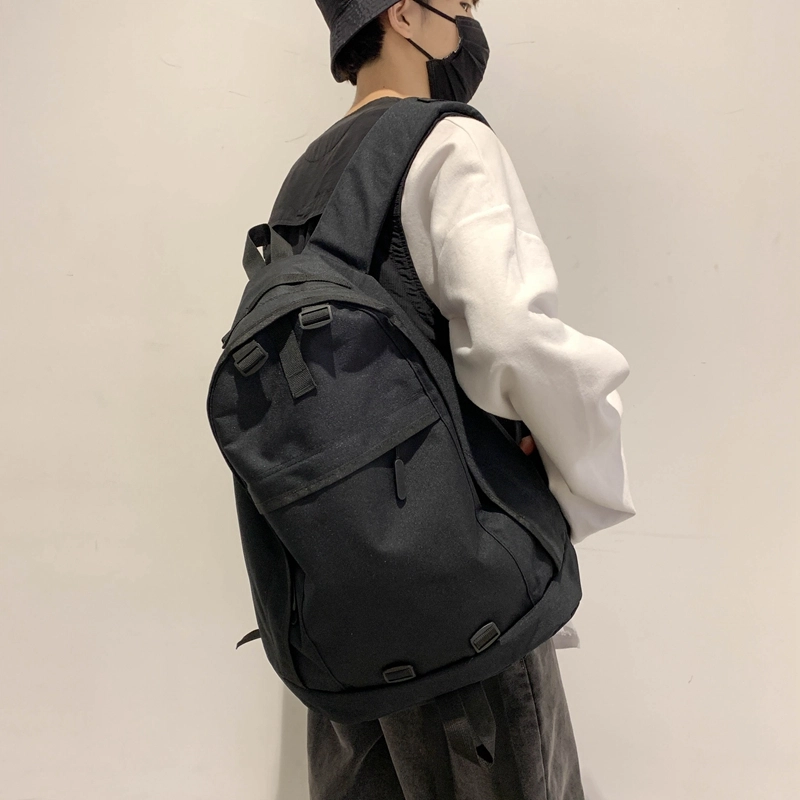 德力熊双肩包大容量休闲简约纯色百搭轻便三色可选双肩背包情侣男女通用 尼龙