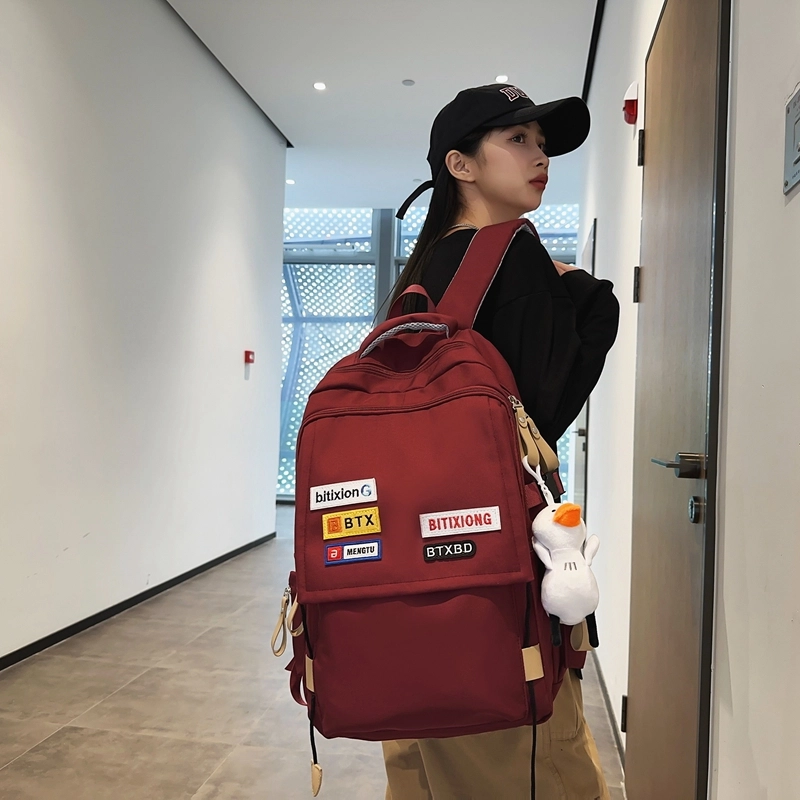 德力熊双肩包尼龙男女通用多色学生书包学院风情侣旅行休闲包学生包大容量耐磨耐脏