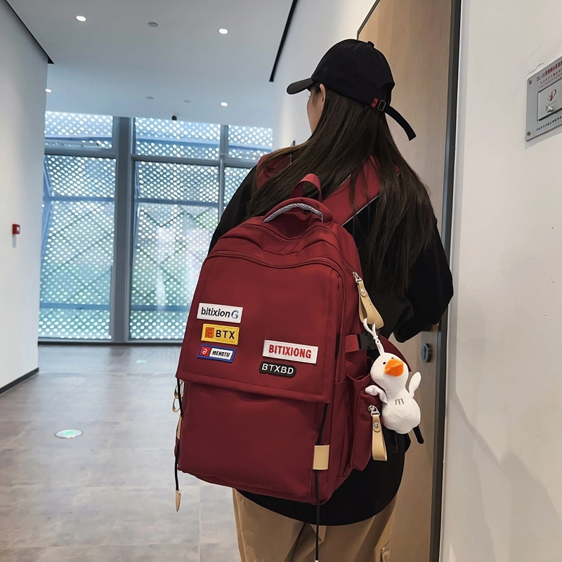 德力熊双肩包尼龙男女通用多色学生书包学院风情侣旅行休闲包学生包大容量耐磨耐脏