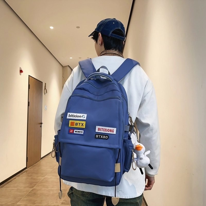 德力熊双肩包尼龙男女通用多色学生书包学院风情侣旅行休闲包学生包大容量耐磨耐脏