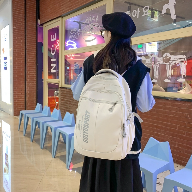 德力熊尼龙书包男女通用多色初中高中生大容量潮牌背包轻便简约大学生双肩包