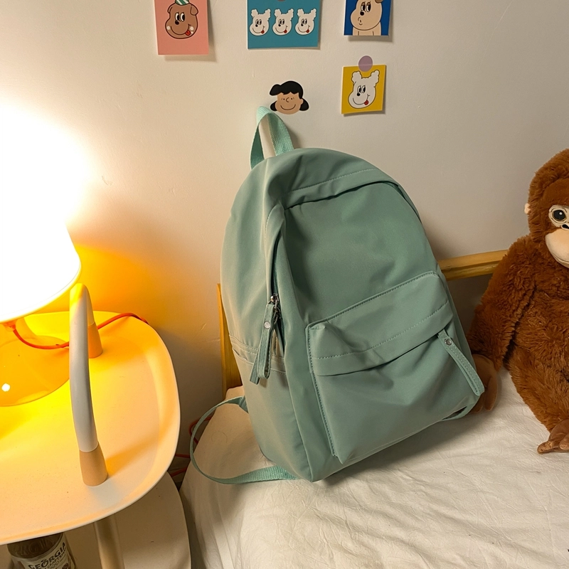 德力熊 纯色大容量书包背包简约通勤轻便旅行 尼龙 双肩包 常规 男女同款情侣款 黑色/蓝色/绿色/粉色/白色