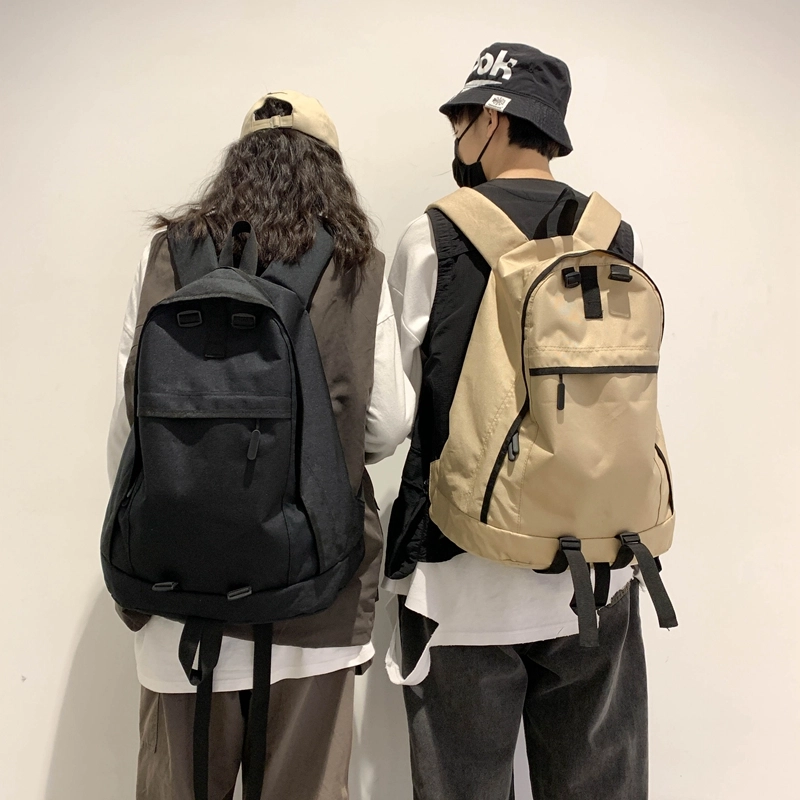 德力熊双肩包大容量休闲简约纯色百搭轻便三色可选双肩背包情侣男女通用 尼龙