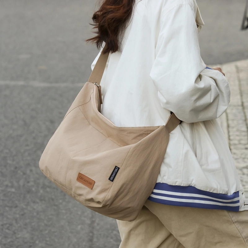 德力熊 尼龙 男女通用 多色 单肩包 日系纯色斜挎学生书包防水轻便大容量包