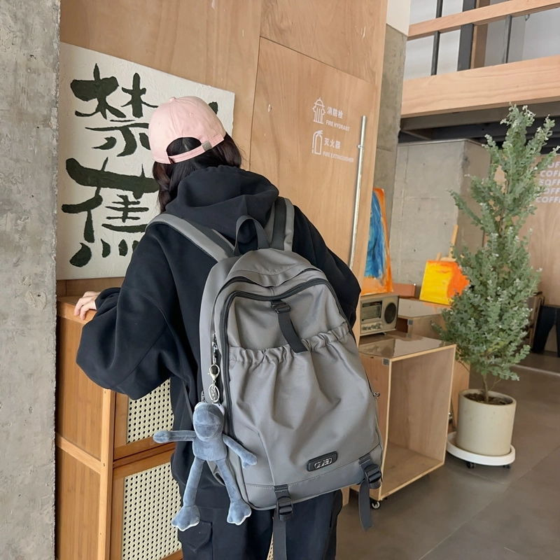 德力熊 轻便百搭简约大容量通用 尼龙 背包双肩包 常规 男女同款情侣款 黑色/粉色/白色/灰色
