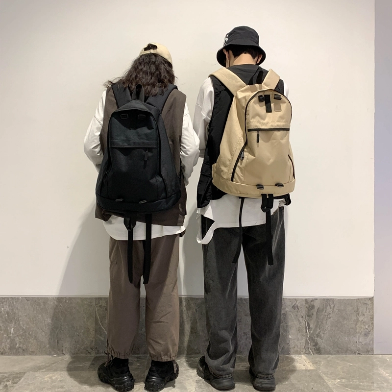 德力熊双肩包大容量休闲简约纯色百搭轻便三色可选双肩背包情侣男女通用 尼龙