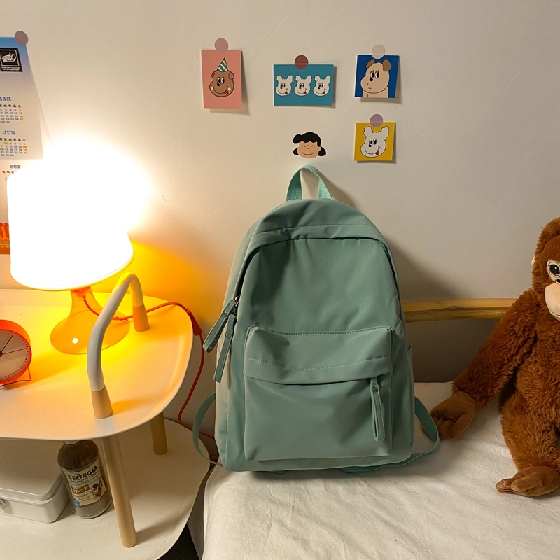 德力熊 纯色大容量书包背包简约通勤轻便旅行 尼龙 双肩包 常规 男女同款情侣款 黑色/蓝色/绿色/粉色/白色