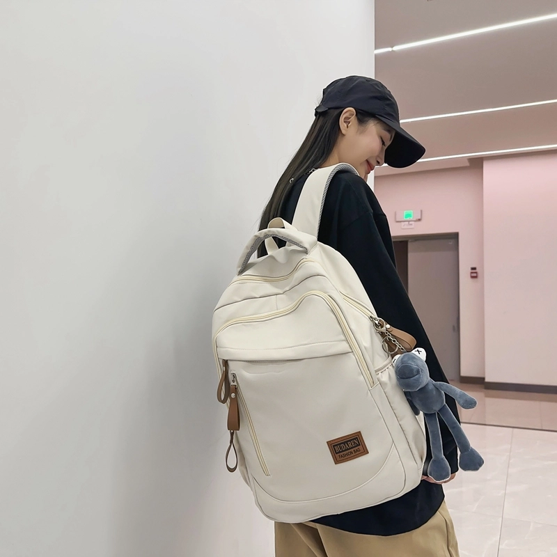 德力熊 潮牌大容量防水轻便多口袋 尼龙 书包背包双肩包 常规 男女同款情侣款 米白色/灰色/红色/蓝色/黑色