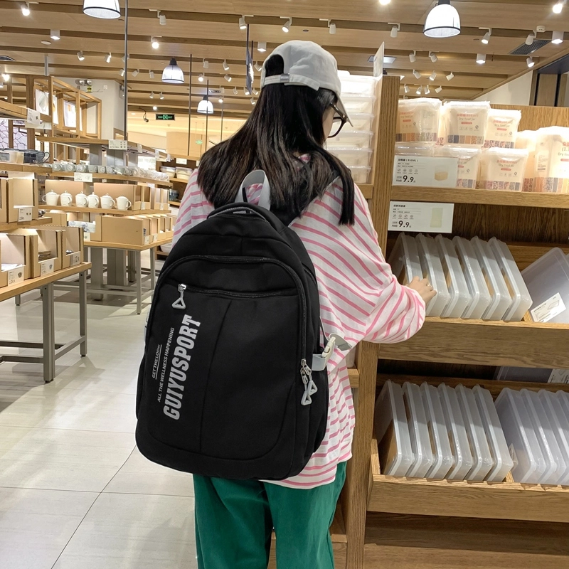 德力熊尼龙书包男女通用多色初中高中生大容量潮牌背包轻便简约大学生双肩包