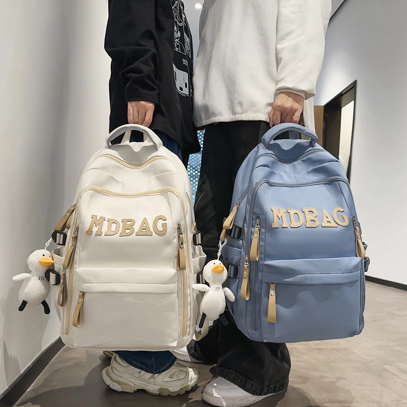 德力熊 小学生初中校园风结实耐脏 尼龙 电脑包旅行书包背包双肩包 常规 男女同款情侣款 红色/黑色/蓝色/白色