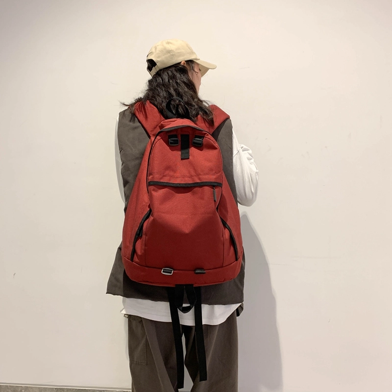德力熊双肩包大容量休闲简约纯色百搭轻便三色可选双肩背包情侣男女通用 尼龙