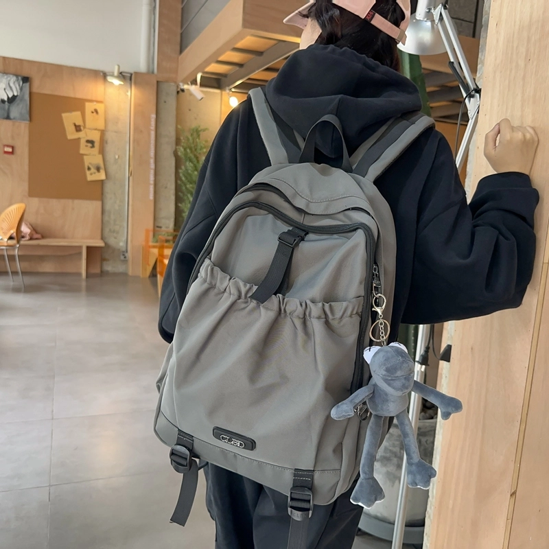 德力熊 轻便百搭简约大容量通用 尼龙 背包双肩包 常规 男女同款情侣款 黑色/粉色/白色/灰色