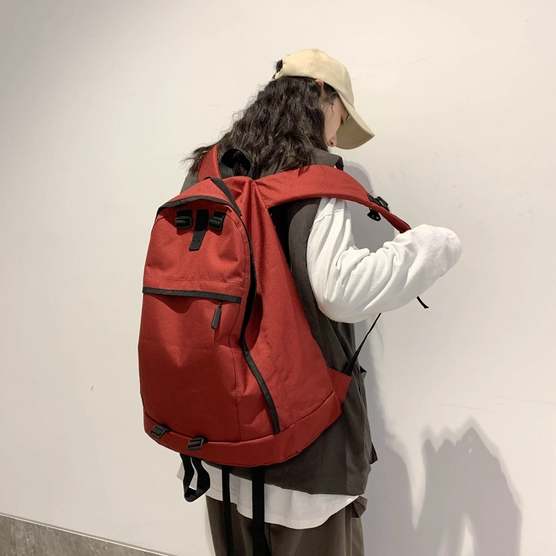 德力熊双肩包大容量休闲简约纯色百搭轻便三色可选双肩背包情侣男女通用 尼龙