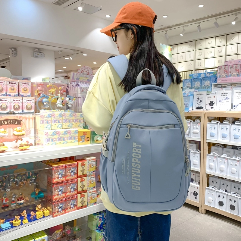德力熊尼龙书包男女通用多色初中高中生大容量潮牌背包轻便简约大学生双肩包
