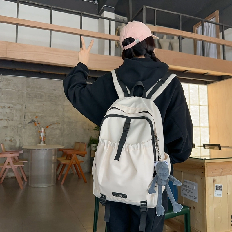 德力熊 轻便百搭简约大容量通用 尼龙 背包双肩包 常规 男女同款情侣款 黑色/粉色/白色/灰色