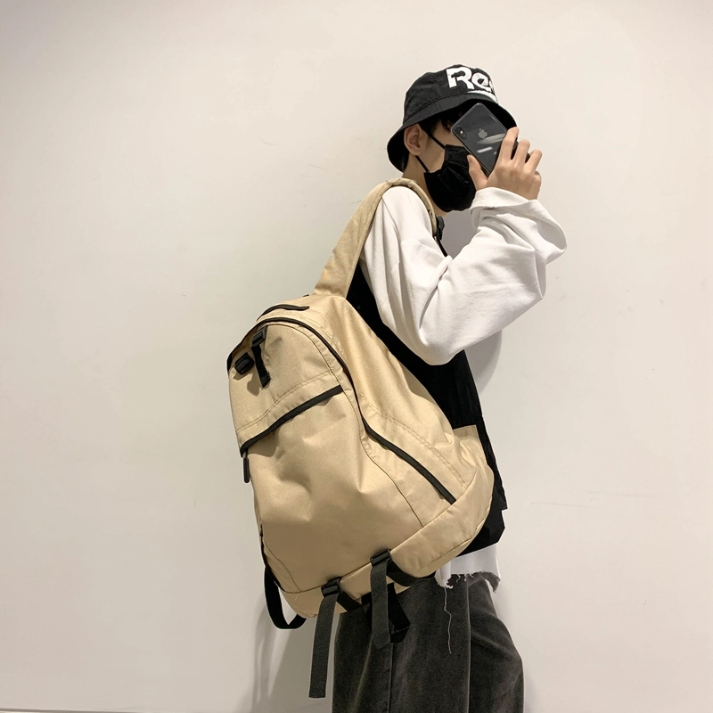 德力熊双肩包大容量休闲简约纯色百搭轻便三色可选双肩背包情侣男女通用 尼龙