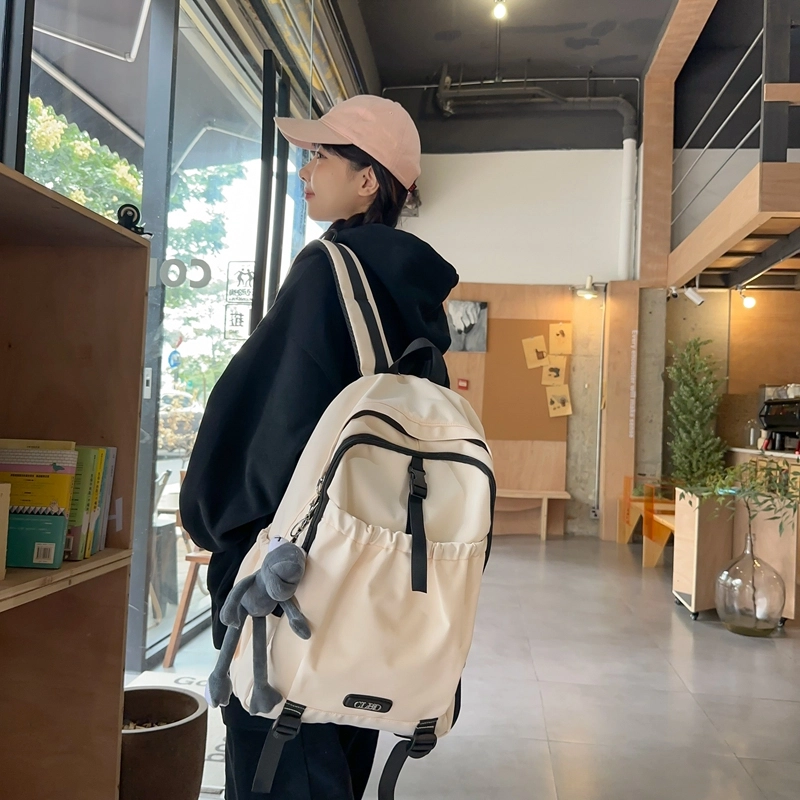 德力熊 轻便百搭简约大容量通用 尼龙 背包双肩包 常规 男女同款情侣款 黑色/粉色/白色/灰色