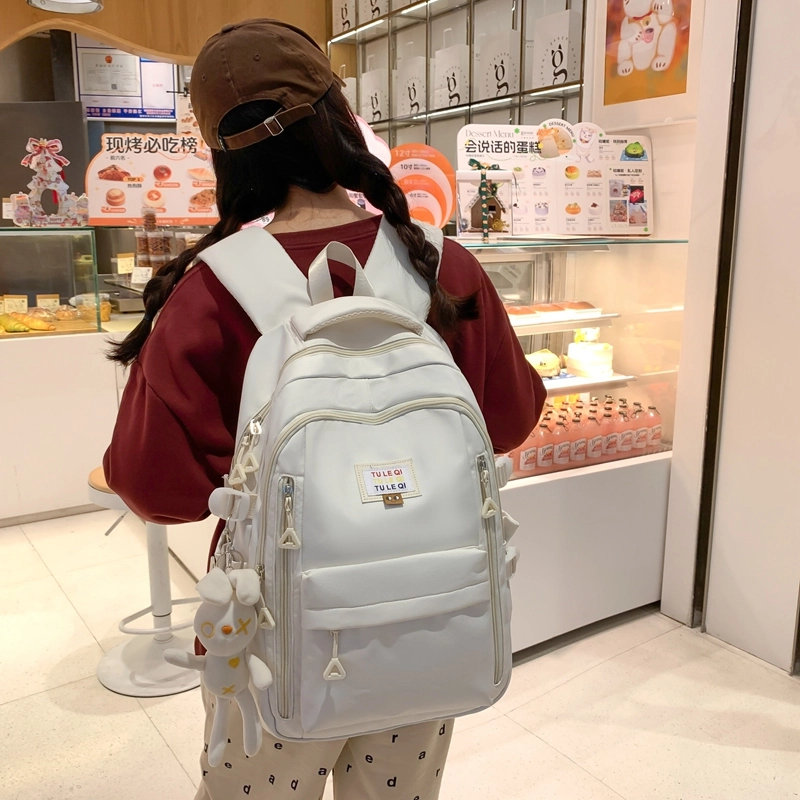 德力熊 韩版大容量简约学生减负休闲 尼龙 书包背包双肩包 常规 男女同款情侣款 粉色/黑色/白色/黄色