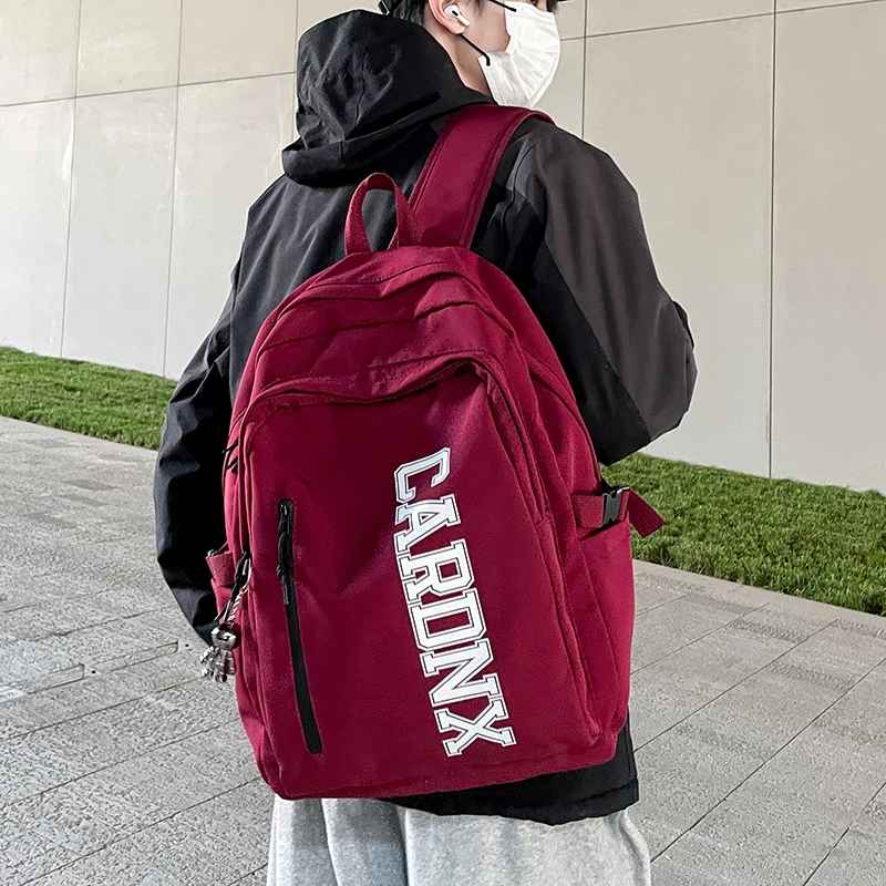 德力熊 大容量韩版大英文字母休闲运动风简约百搭潮酷 尼龙 书包背包双肩包 大号 男女同款情侣款 黑色/白色/蓝色/红色