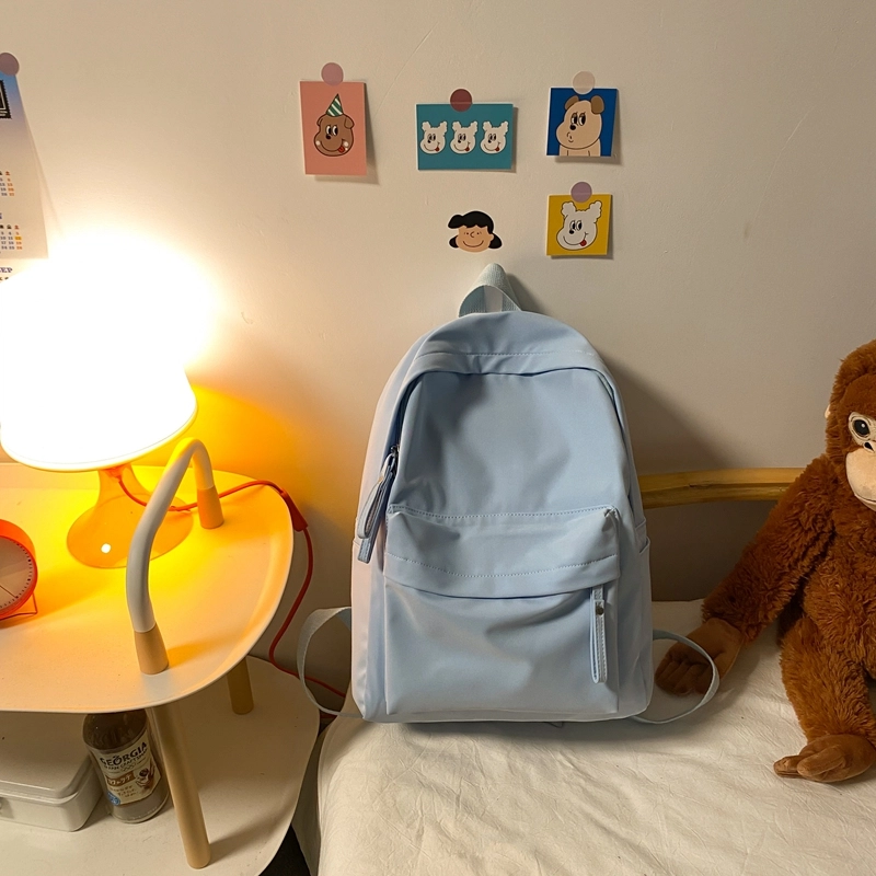 德力熊 纯色大容量书包背包简约通勤轻便旅行 尼龙 双肩包 常规 男女同款情侣款 黑色/蓝色/绿色/粉色/白色
