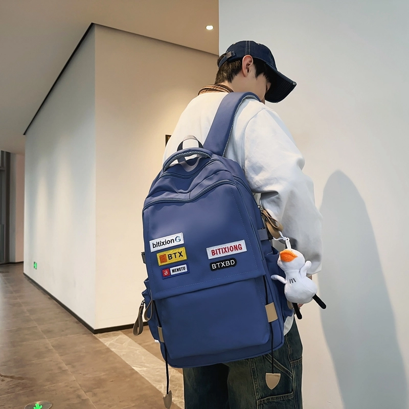 德力熊双肩包尼龙男女通用多色学生书包学院风情侣旅行休闲包学生包大容量耐磨耐脏