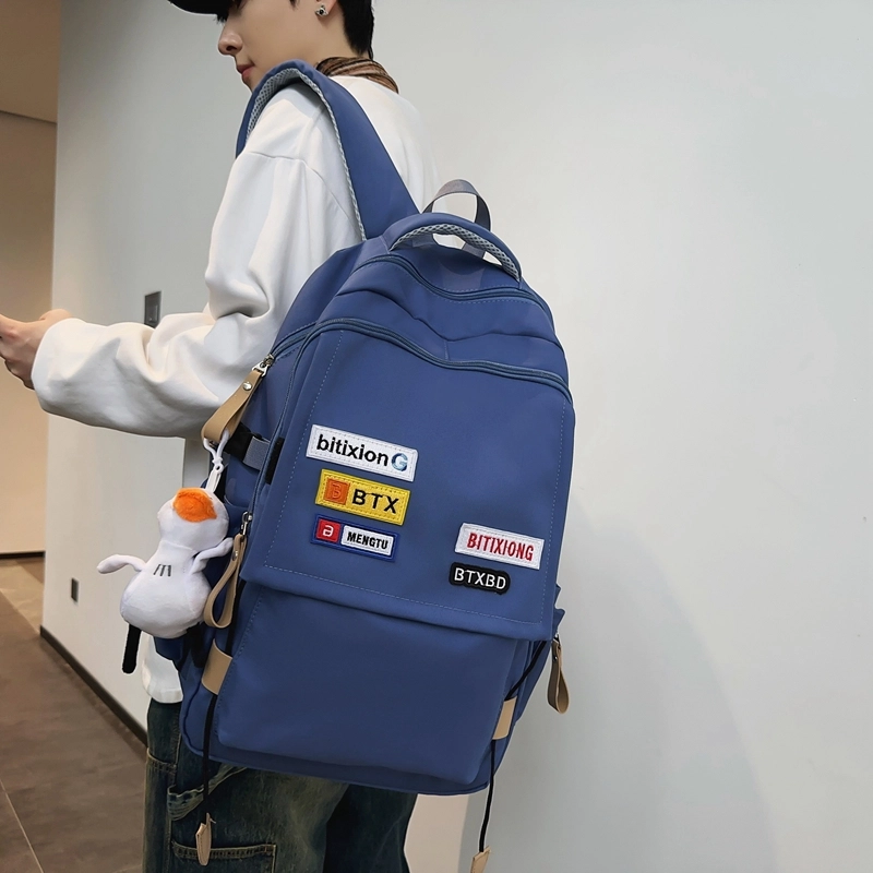 德力熊双肩包尼龙男女通用多色学生书包学院风情侣旅行休闲包学生包大容量耐磨耐脏