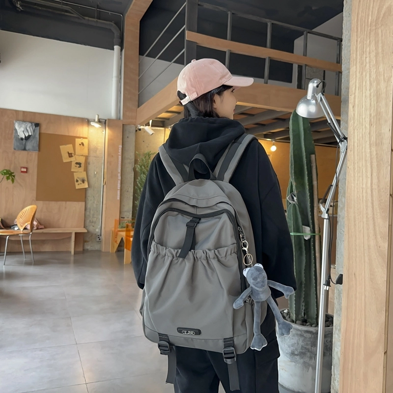 德力熊 轻便百搭简约大容量通用 尼龙 背包双肩包 常规 男女同款情侣款 黑色/粉色/白色/灰色