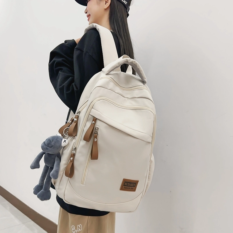 德力熊 潮牌大容量防水轻便多口袋 尼龙 书包背包双肩包 常规 男女同款情侣款 米白色/灰色/红色/蓝色/黑色