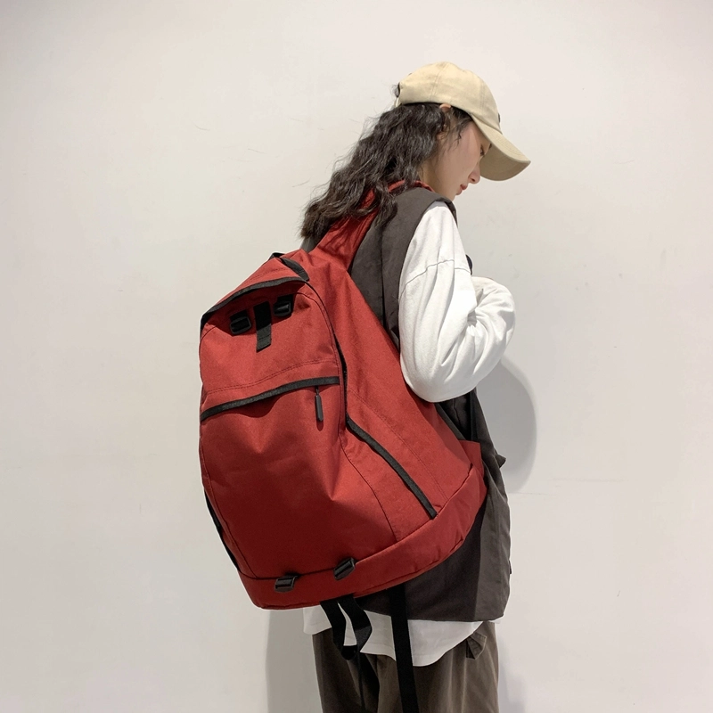 德力熊双肩包大容量休闲简约纯色百搭轻便三色可选双肩背包情侣男女通用 尼龙