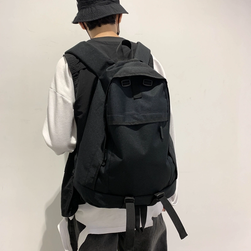 德力熊双肩包大容量休闲简约纯色百搭轻便三色可选双肩背包情侣男女通用 尼龙