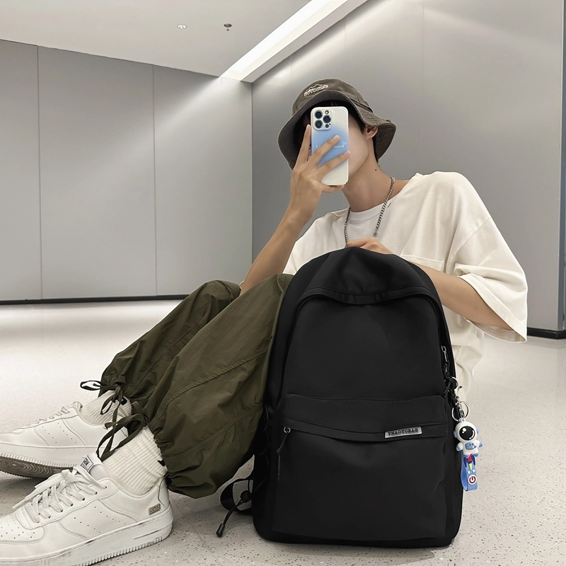 德力熊 简约大容量旅行轻便 尼龙 书包背包双肩包 大号 白色/黑色