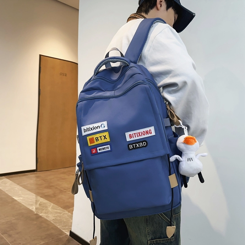 德力熊双肩包尼龙男女通用多色学生书包学院风情侣旅行休闲包学生包大容量耐磨耐脏