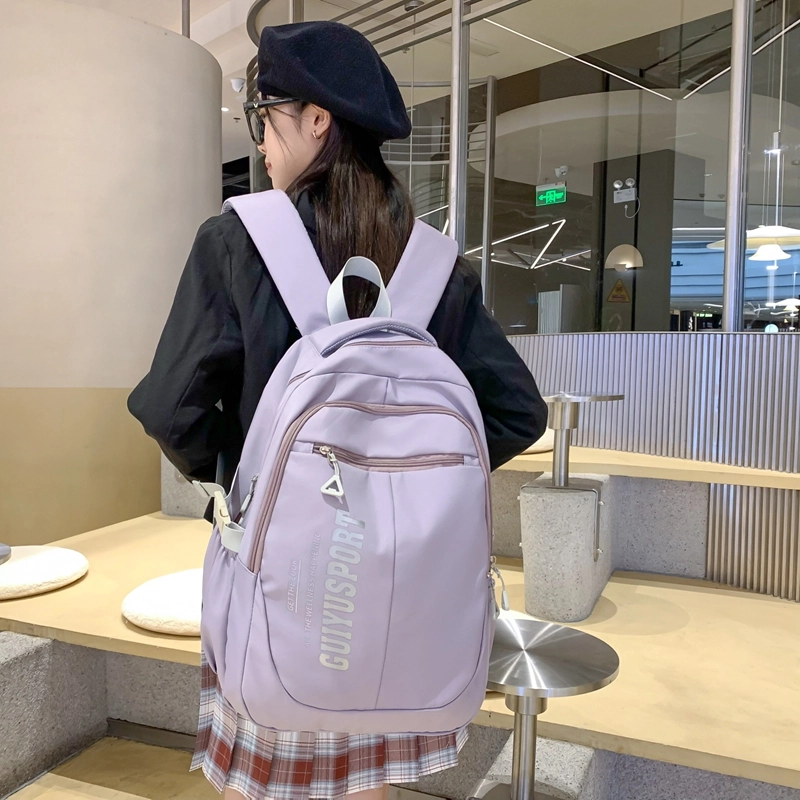 德力熊尼龙书包男女通用多色初中高中生大容量潮牌背包轻便简约大学生双肩包