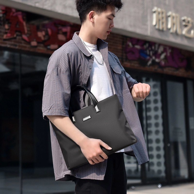 德力熊 拉链开合 尼龙 斜挎包手提包 常规 男款 蓝/黑