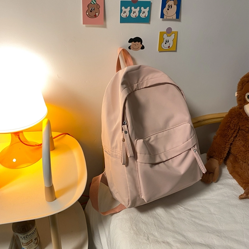 德力熊 纯色大容量书包背包简约通勤轻便旅行 尼龙 双肩包 常规 男女同款情侣款 黑色/蓝色/绿色/粉色/白色