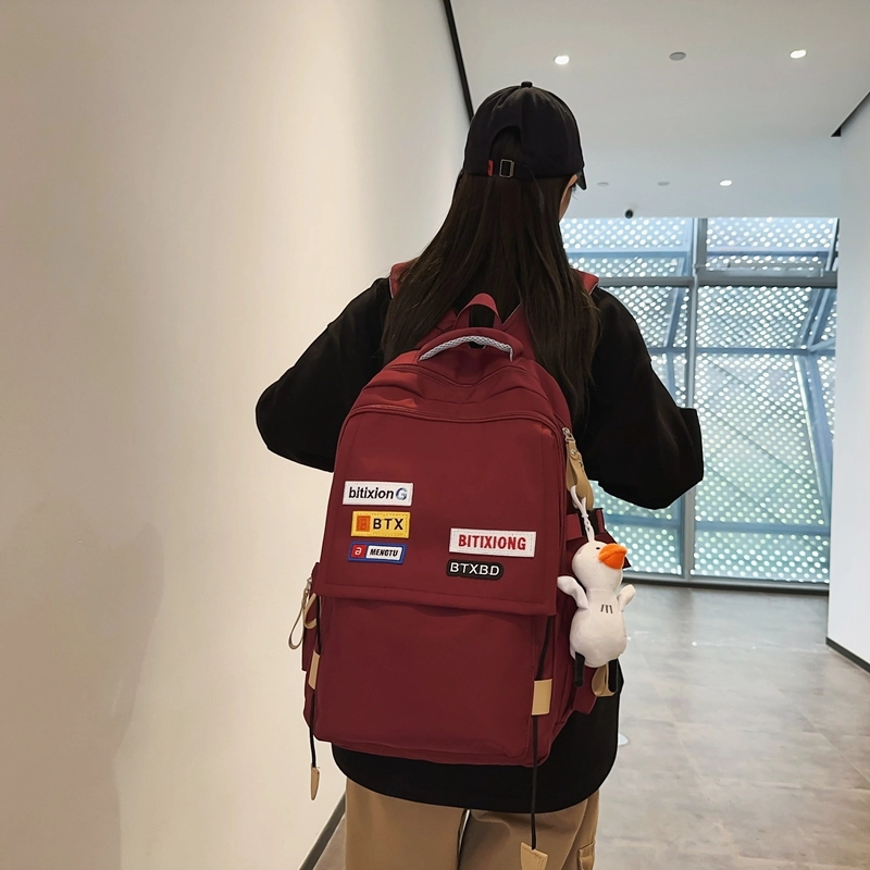 德力熊双肩包尼龙男女通用多色学生书包学院风情侣旅行休闲包学生包大容量耐磨耐脏