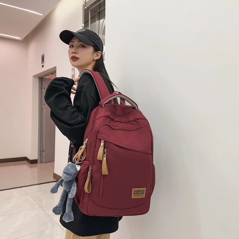 德力熊 潮牌大容量防水轻便多口袋 尼龙 书包背包双肩包 常规 男女同款情侣款 米白色/灰色/红色/蓝色/黑色