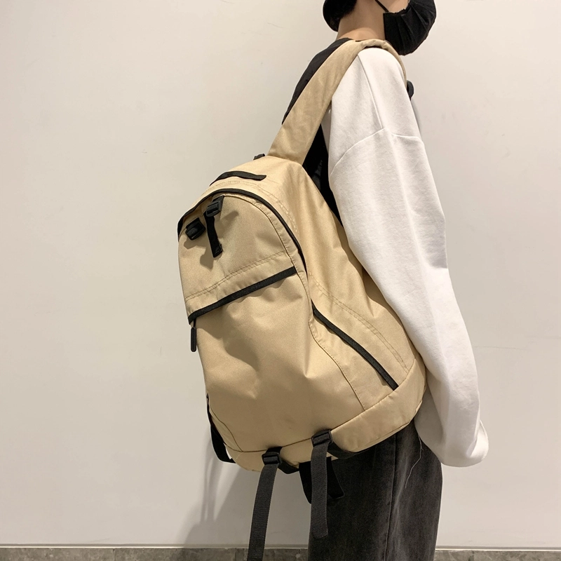 德力熊双肩包大容量休闲简约纯色百搭轻便三色可选双肩背包情侣男女通用 尼龙