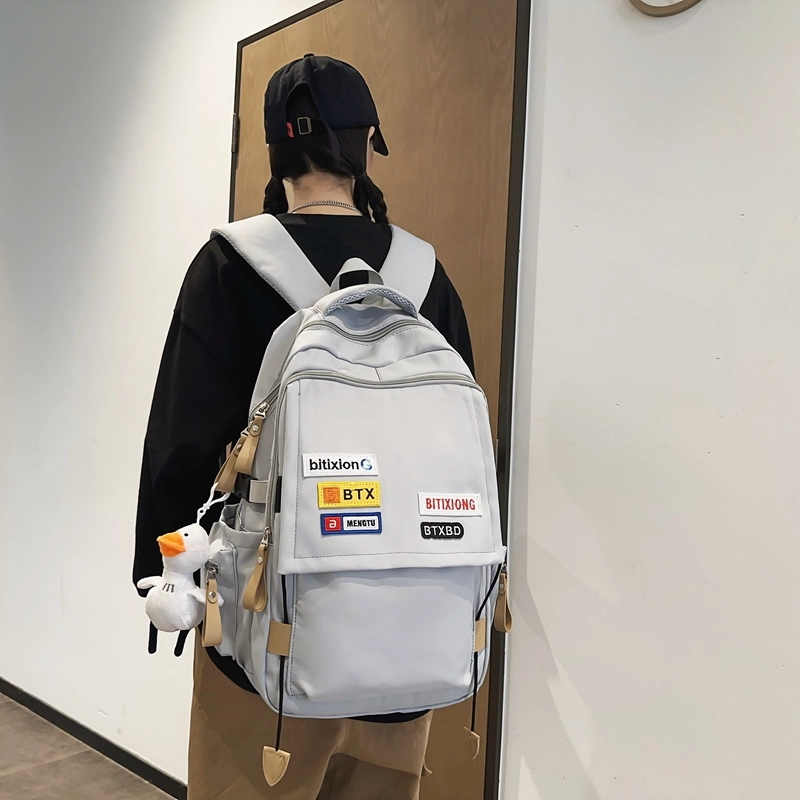 德力熊双肩包尼龙男女通用多色学生书包学院风情侣旅行休闲包学生包大容量耐磨耐脏