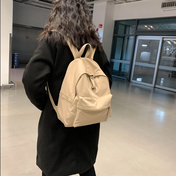 艾妮兔 日系简约百搭初高中大学生休闲通勤 帆布 书包帆布包双肩包 男女同款情侣款 米白色/卡其色/蓝色/黑色