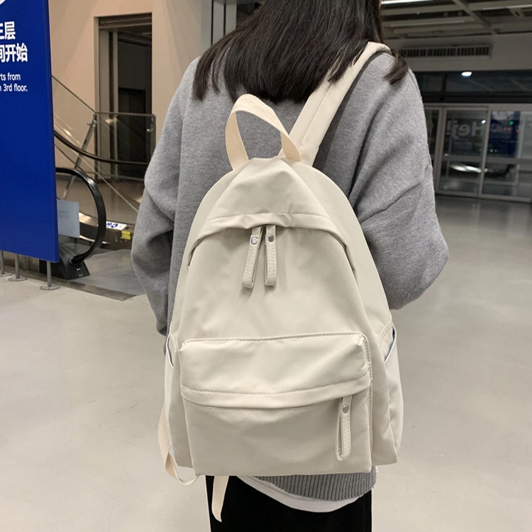 艾妮兔 日系简约百搭初高中大学生休闲通勤 帆布 书包帆布包双肩包 男女同款情侣款 米白色/卡其色/蓝色/黑色